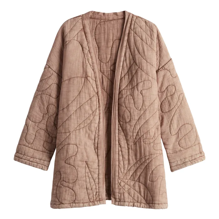 Tan quilted kimono-style jacket with leaf-pattern topstitching, laid flat on white